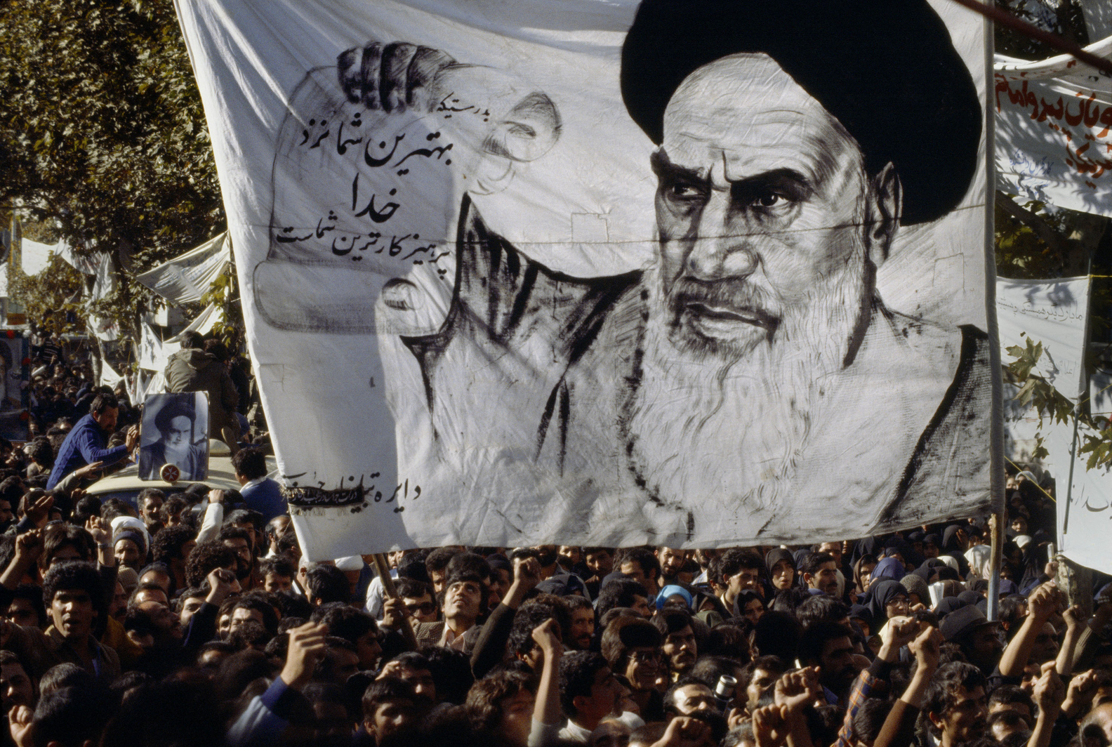 demonstrators rally under banner of ayatollah khomeini